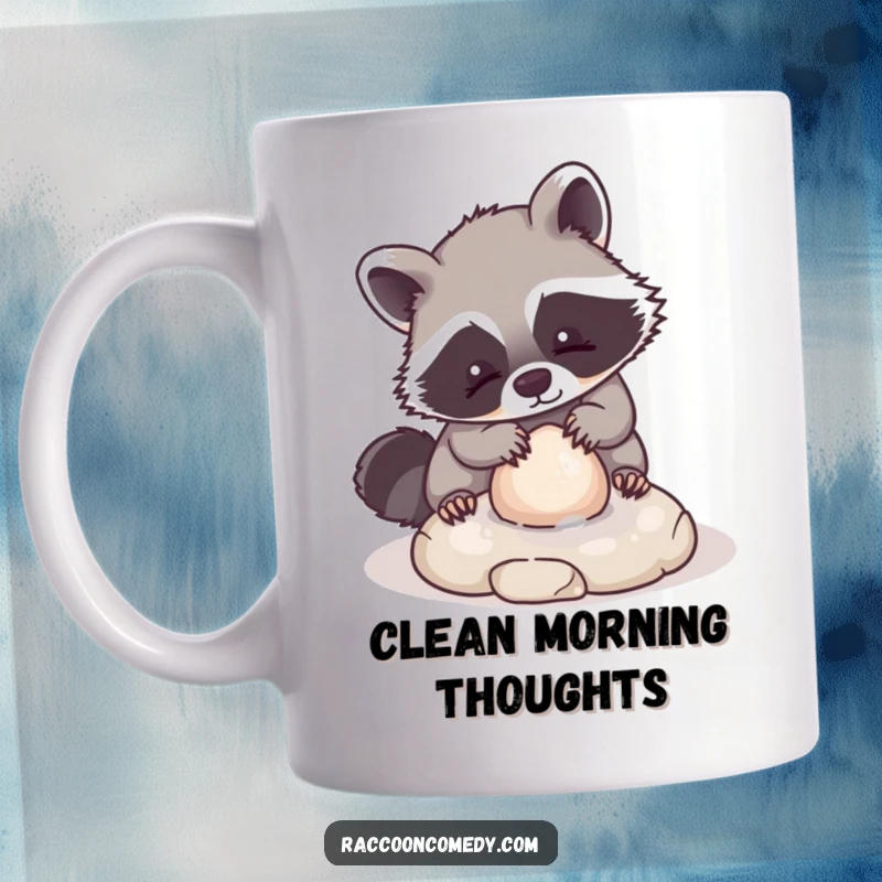 Funny mug showcasing a kawaii raccoon character playfully scrubbing a small, round stone with a gentle expression, radiating cuteness and calm.
