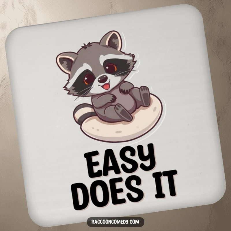 Funny raccoon coaster featuring a gleeful raccoon sliding down a smooth surface, a hilarious addition to any table.