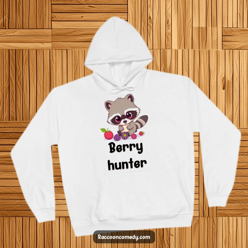 Funny Raccoon Hoodie: A soft hoodie showcasing a raccoon with incredibly wide eyes, humorously chasing rolling berries.