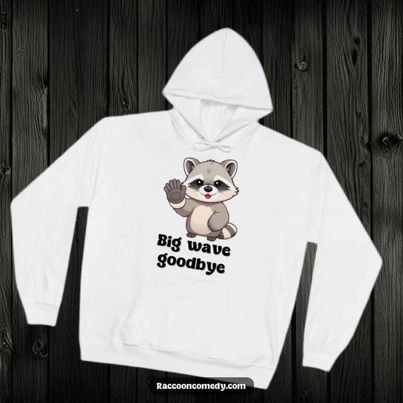 Funny kawaii raccoon in oversized gloves, enthusiastically waving goodbye on a warm and humorous hoodie.
