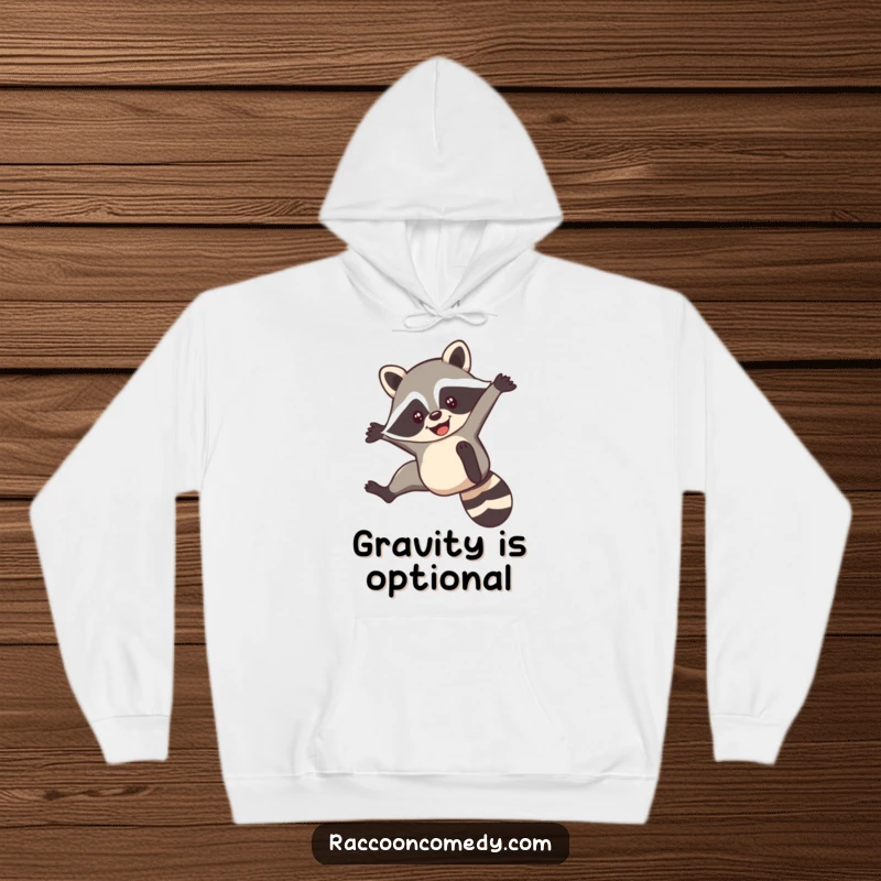 Funny hoodie featuring a smiling raccoon performing a nimble acrobatic flip, perfect for those with an active spirit.