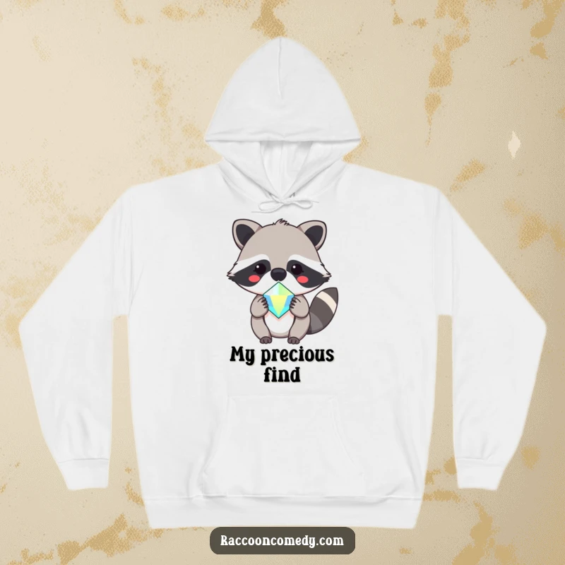 Funny, soft hoodie featuring a lovable kawaii raccoon with a happy expression, presenting a shiny, sparkling gem.