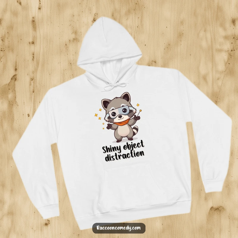 Funny kawaii raccoon wearing a bandit mask, juggling treasures on a warm hoodie, ideal for cozy and humorous wear.
