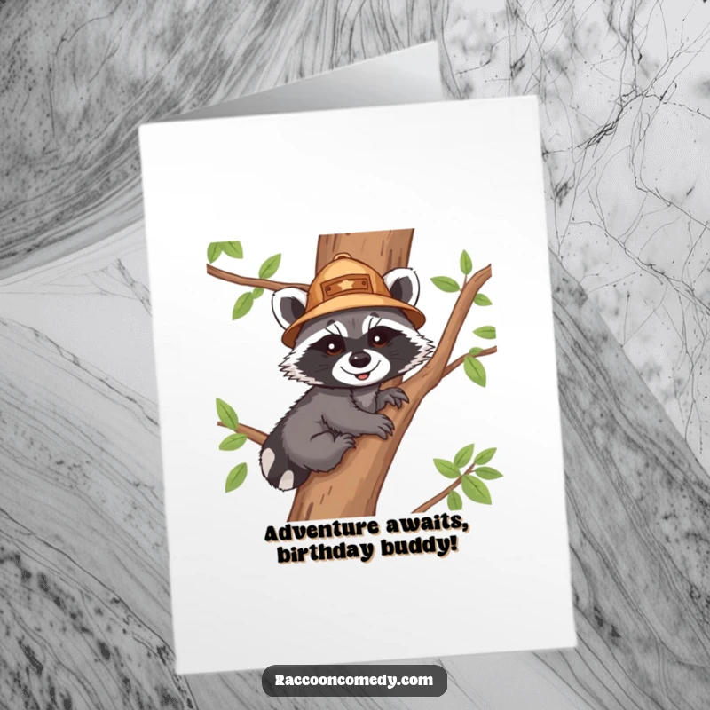 Funny Free Printable Birthday Card: Raccoon cub in explorer hat joyfully climbs tree, perfect unique downloadable gift.