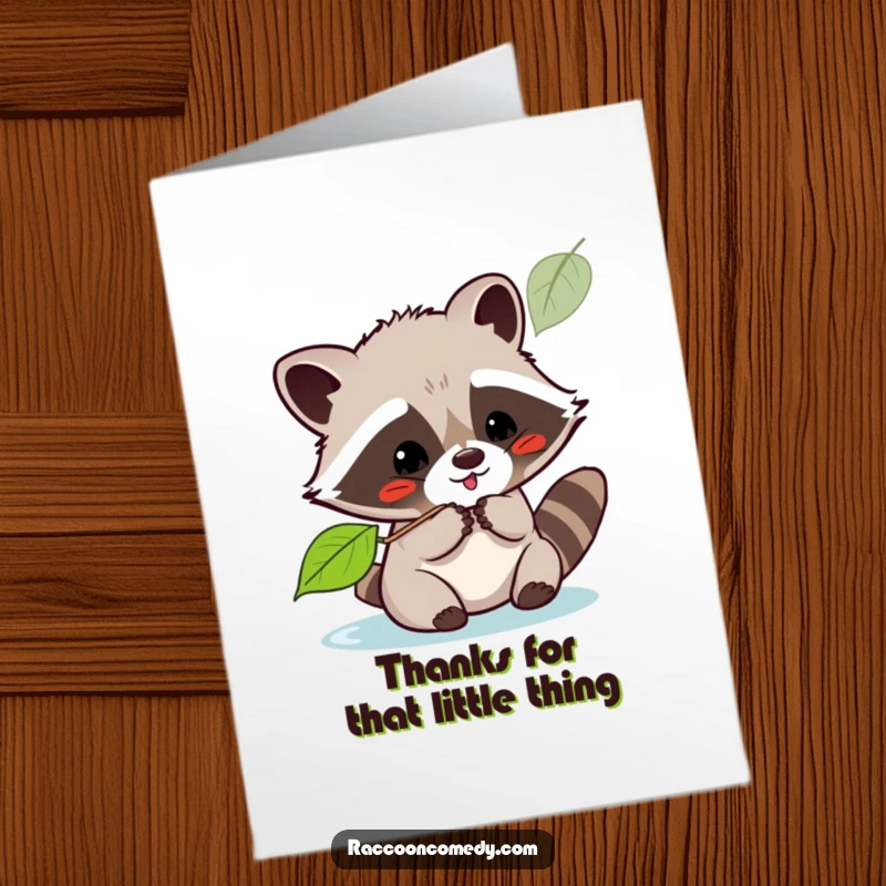 Cute Free Printable Thank You Card: Kawaii raccoon playfully batting at a floating leaf, expressing thanks.