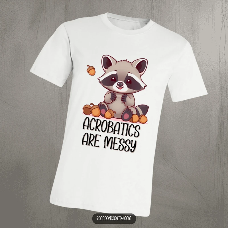 Funny kawaii raccoon with oversized paws hilariously attempting to juggle acorns, printed on a soft and comfortable t-shirt.