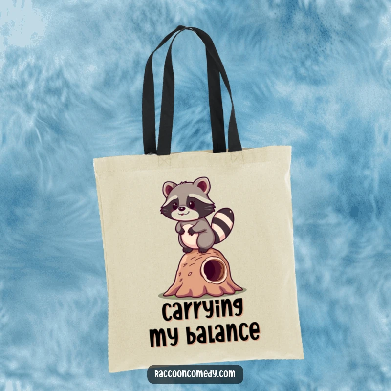 Funny kawaii raccoon attempting to balance on a log, humorously depicted on a durable tote bag for daily use.